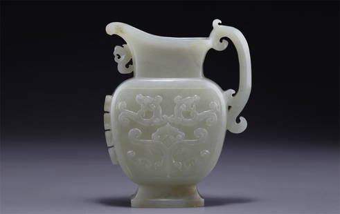 A HETIAN JADE POT WITH BEAST FACE DESIGN.: Hetian Jade Pot with Beast Face Design and A Handle.