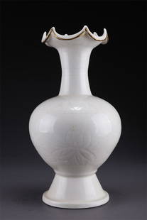 A PORCELAIN BOTTLE WITH CARVED FLOWERS DESIGN.: Porcelain Bottle with Carved Flowers Design and Flower-Shaped Opening, Ding Kiln.