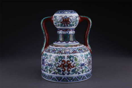 A GOURD-SHAPED PORCELAIN BOTTLE.: Contrasting Color Gourd-Shaped Porcelain Bottle with Ribbon Design.