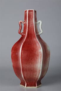 A RED GLAZED SIX-ARRIS PORCELAIN BOTTLE.: Red Glazed Six-Arris Porcelain Display Bottle with Two Ears.