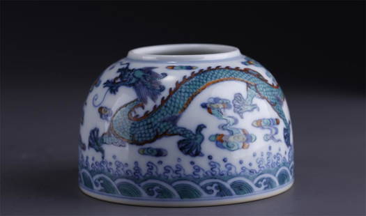 A PORCELAIN WATER POT WITH DRAGON DESIGN.: Contrasting Color Porcelain Water Pot with Dragon, Clouding and Seawater Design.