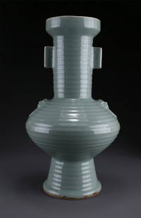 A PORCELAIN BOTTLE WITH BEAST FACE DESIGN.: Porcelain Bottle with Pierced Ears and Beast Face Design, Longquan Kiln.