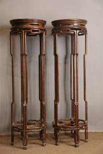 A PAIR OF HUANGHUALI WOOD FLOWER STANDS.: A Pair of Huanghuali Wood Flower Stands.