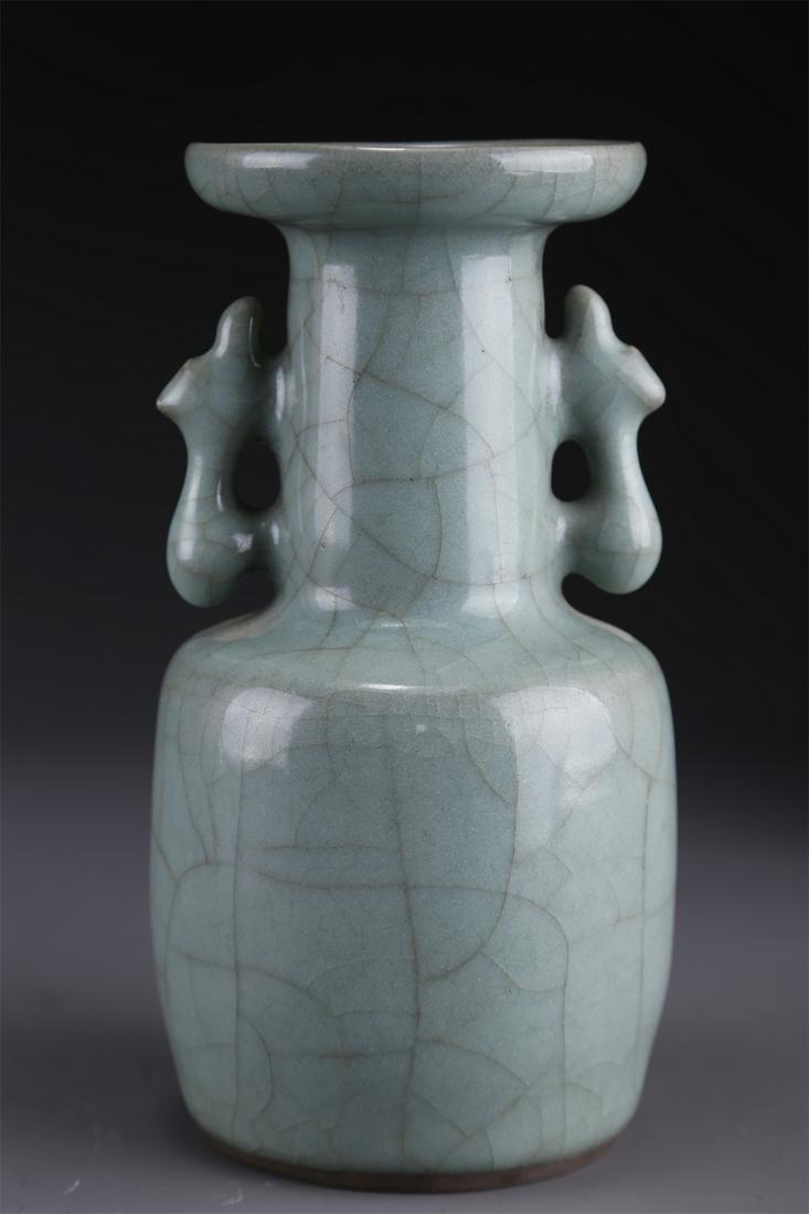 A PORCELAIN BOTTLE WITH DISC-SHAPED OPENING. (1 of 9)