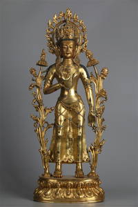 A GILT BRONZE GREEN TARA BUDDHA STATUE.