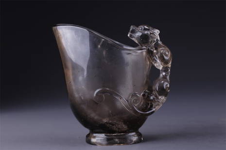 A CRYSTAL CUP WITH CARVED DRAGON DESIGN.: Crystal Cup with Carved Dragon Design.