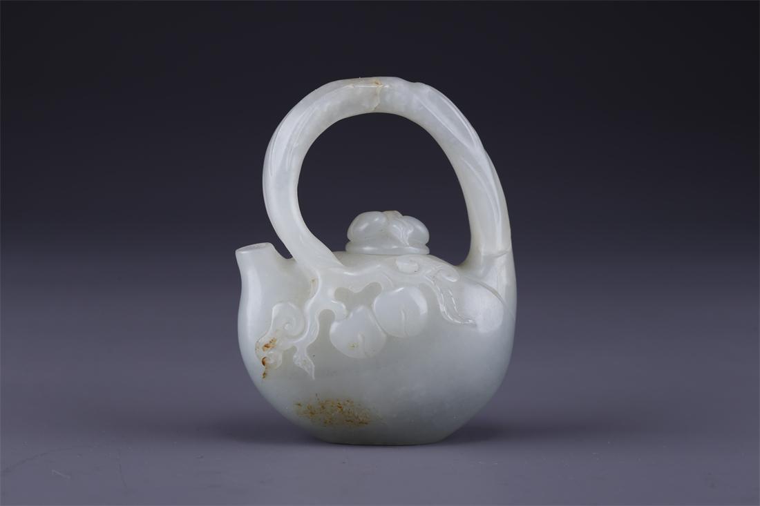 A HETIAN JADE POT WITH LOOP HANDLE. (1 of 9)