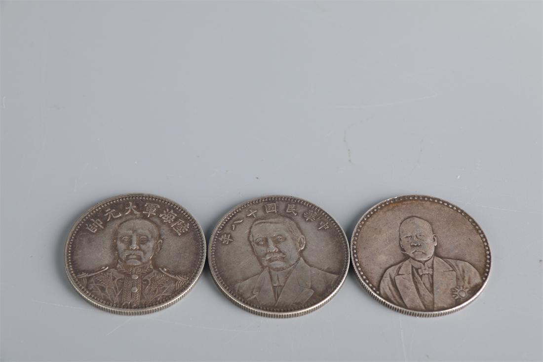 THREE ONE-YUAN SILVER COINS. (1 of 8)