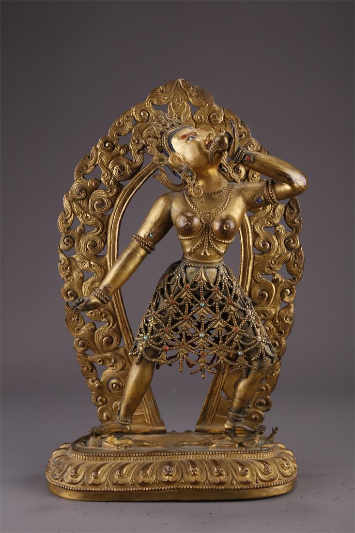 A TIBETAN GILT BRONZE NARO KHECHARI STATUE. (1 of 9)