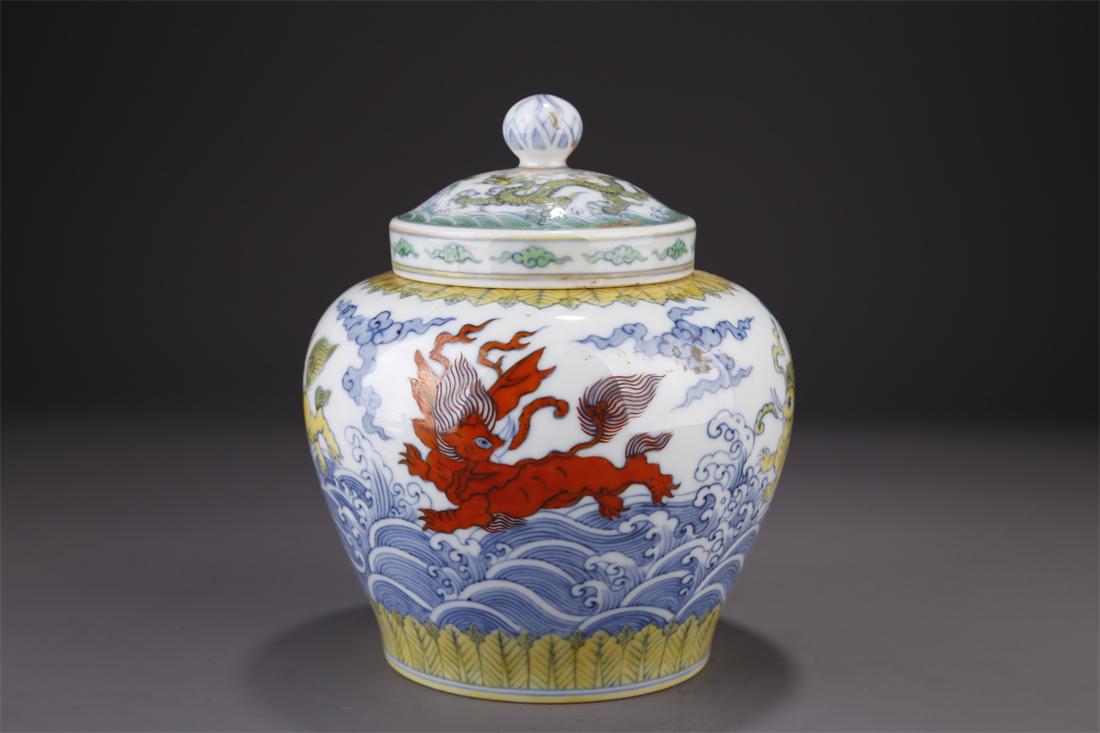 A PORCELAIN LIDDED JAR WITH FLYING HORSE MOTIF. (1 of 10)