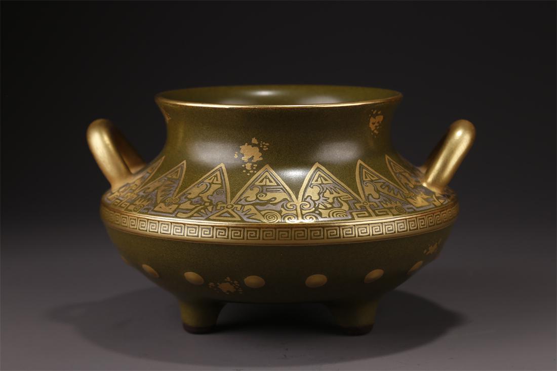 A TEA-DUST GLAZED WEEL-SHAPED PORCELAIN JAR. (1 of 9)