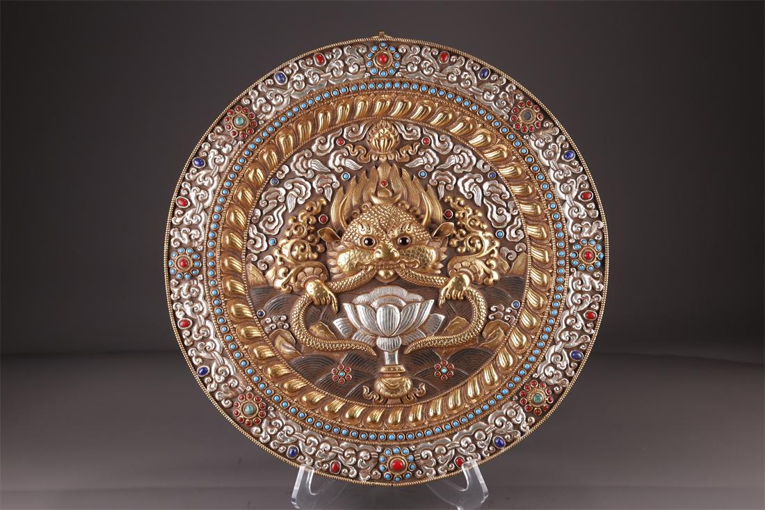 A TIBETAN BRONZE SUPARNA BUDDHA PLATE. (1 of 9)