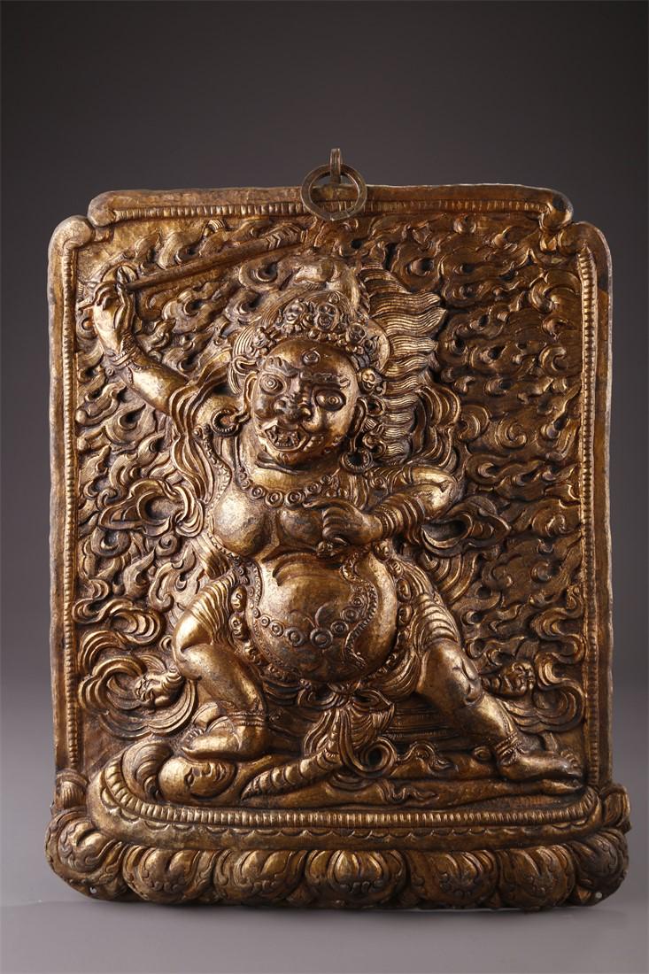 A TIBETAN GILT BRONZE ACALANATHA BUDDHA PLATE. (1 of 7)