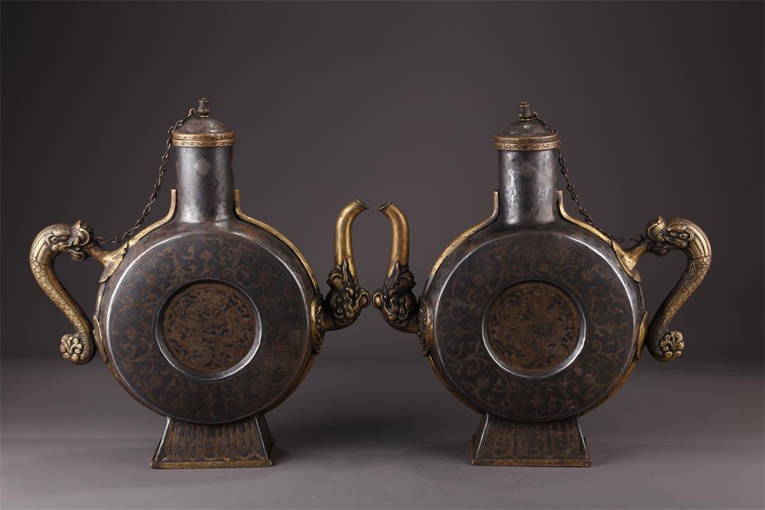 A PAIR OF TIBETAN BRONZE POTS. (1 of 10)