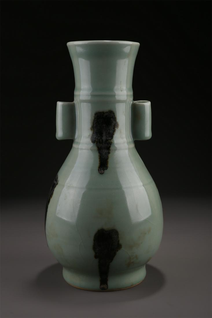 A PORCELAIN BOTTLE WITH PIERCED EARS. (1 of 9)