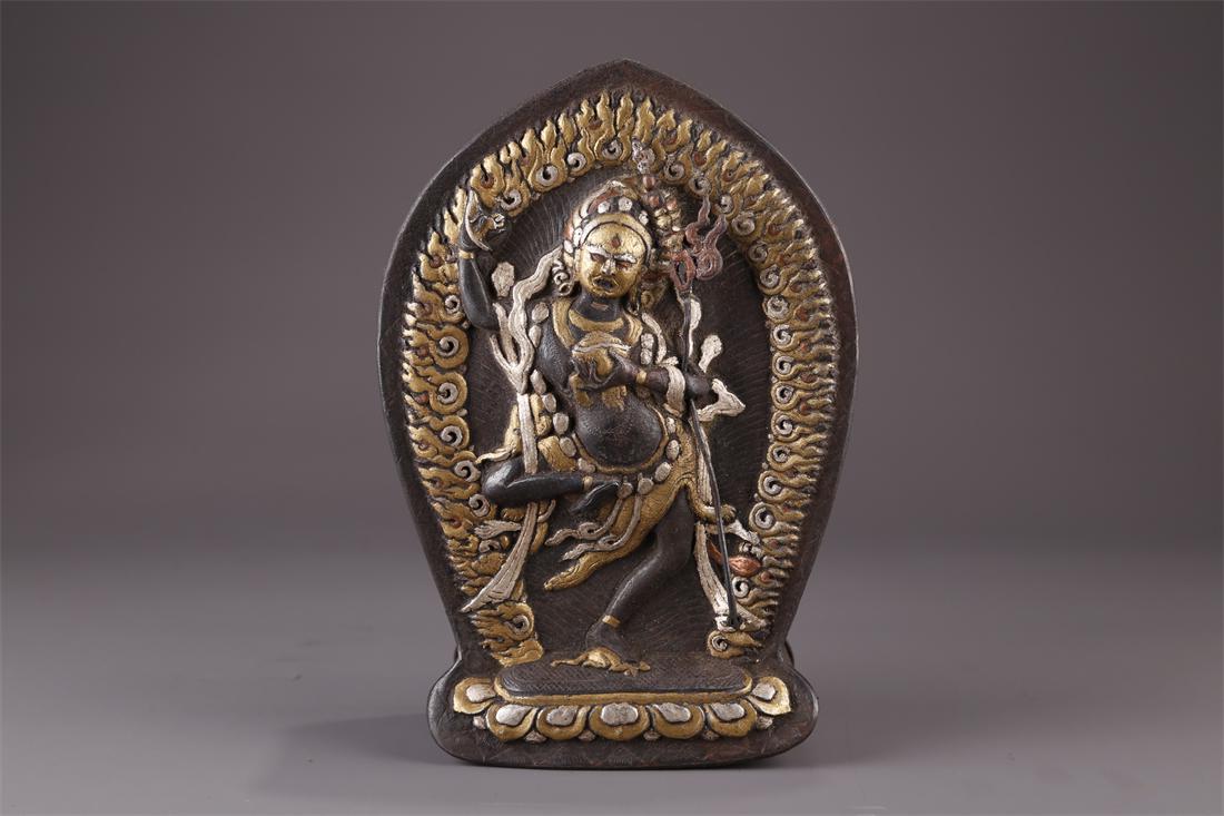 A TIBETAN CAST IRON DAKINI BUDDHA NICHE. (1 of 9)