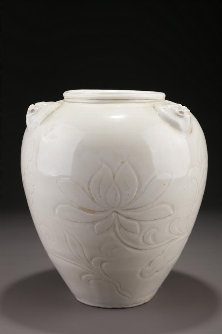 A PORCELAIN JAR WITH LOTUS DESIGN, DING KILN. (1 of 8)