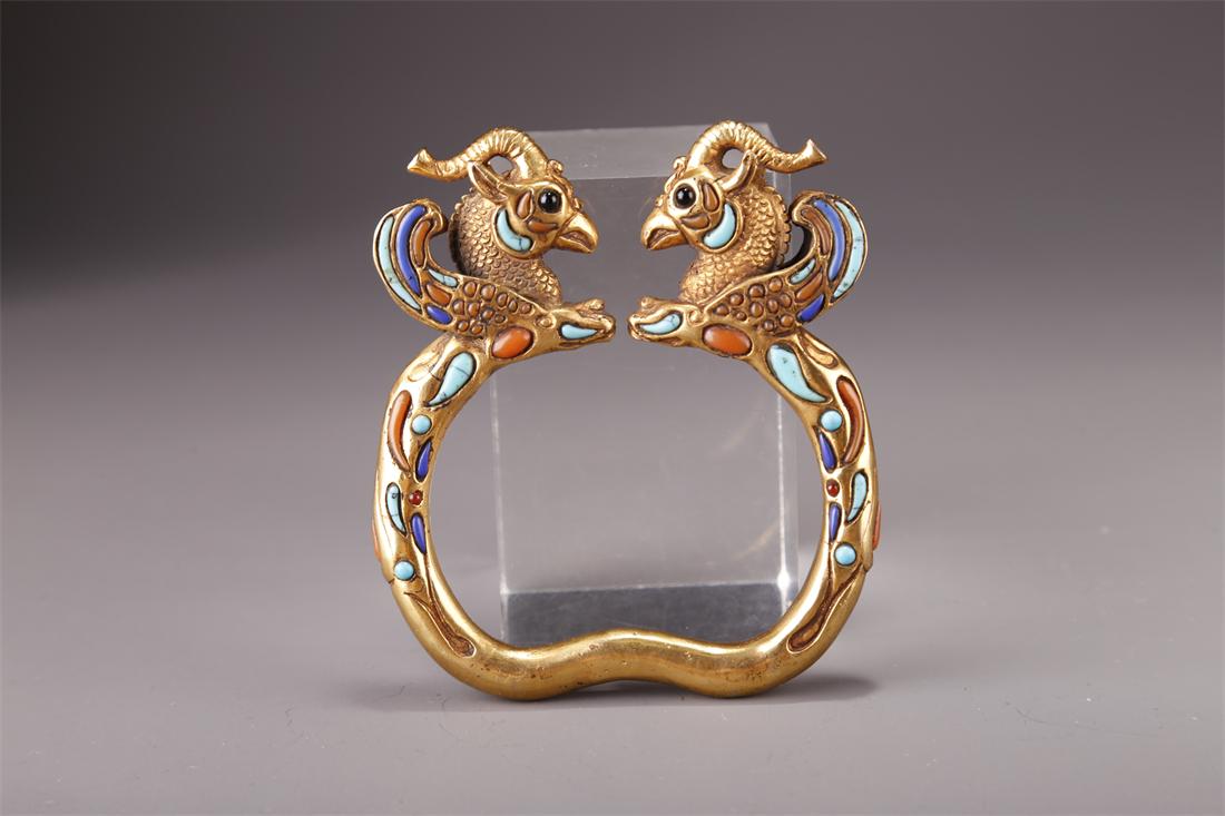 A GILT BRONZE BANGLE WITH PHOENIX DESIGN. (1 of 7)