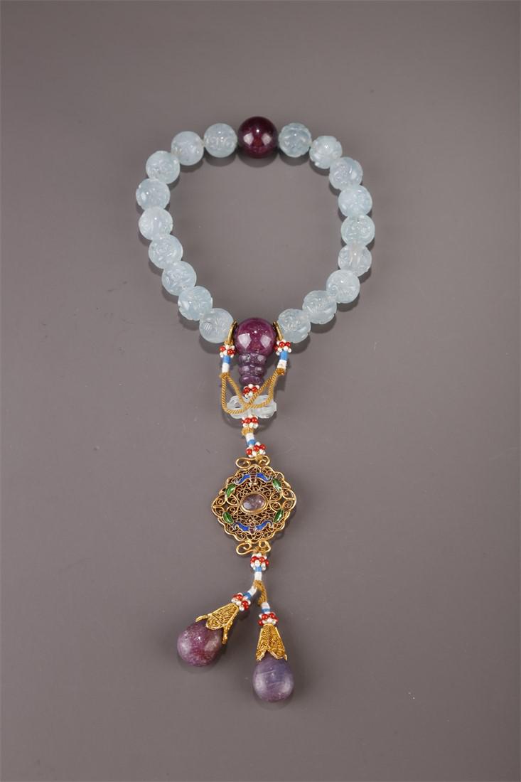 A STRING OF HANDHELD AQUAMARINE BEADS. (1 of 8)