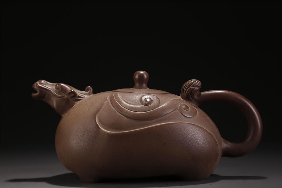 A BEAST-SHAPED PURPLE CLAY TEAPOT. (1 of 7)