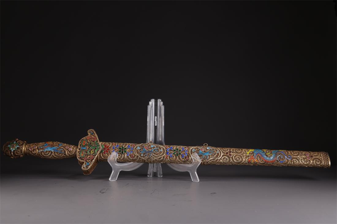A GILT SILVER FILIGREE DOUBLE-BLADE SWORD. (1 of 10)