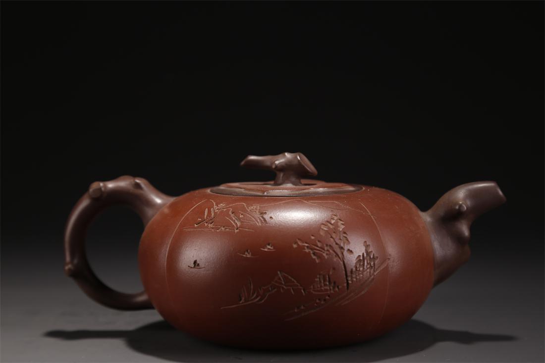 A PURPLE CLAY TEAPOT WITH LANDSCAPE DESIGN. (1 of 8)