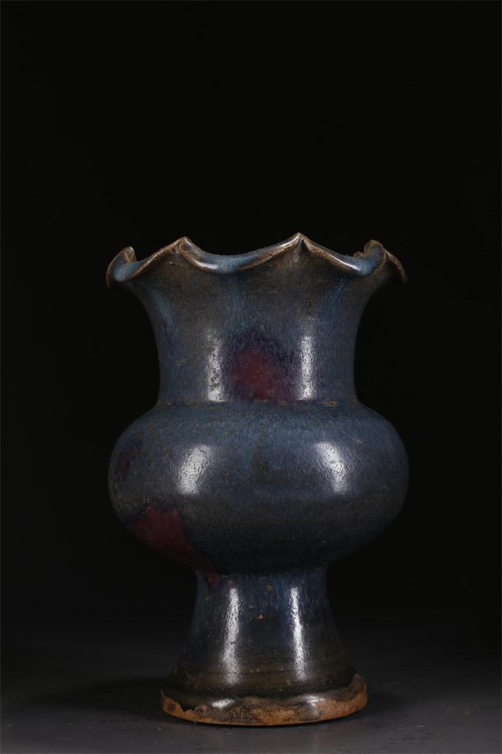 A PORCELAIN BOTTLE WITH FLOWER-SHAPED OPENING. (1 of 6)