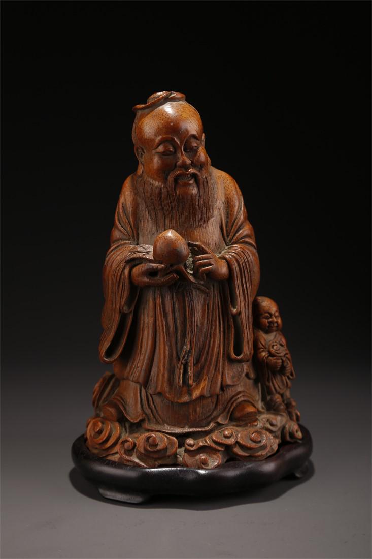 A BAMBOO LONGEVOUS MAN STATUE ORNAMENT. (1 of 10)