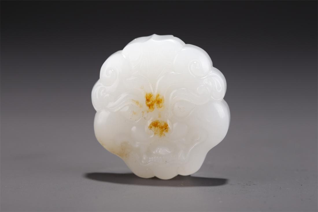 A HETIAN JADE BELT BUCKLE WITH BEAST DESIGN. (1 of 6)