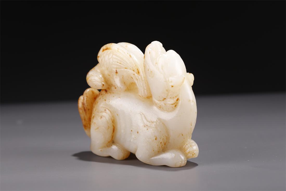 A HETIAN JADE AUSPICIOUS BEAST CARVING. (1 of 9)