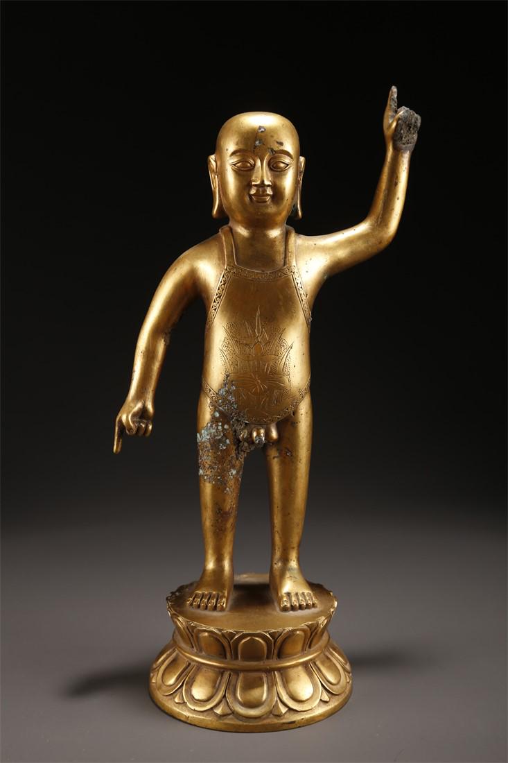 A GILT BRONZE INFANCY SAKYAMUNI BUDDHA STATUE. (1 of 9)
