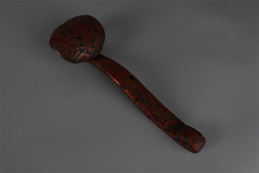 A RED LACQUER RUYI CARVING. (1 of 9)