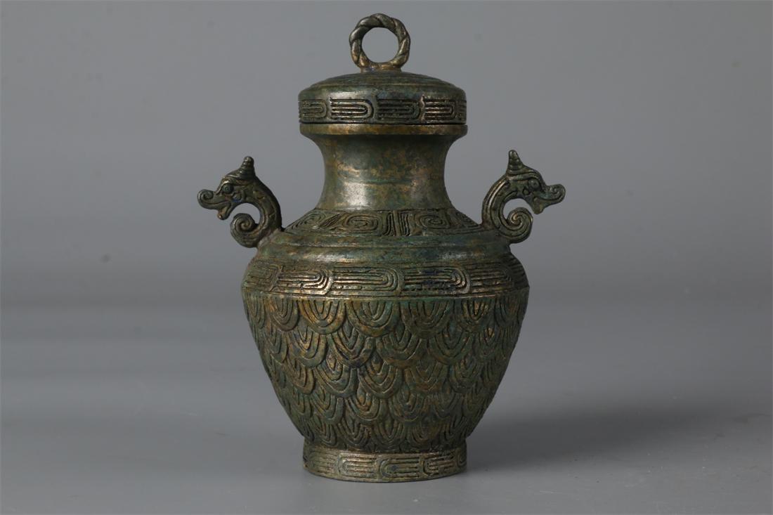 A BRONZE POT WITH BEAST-SHAPED EARS. (1 of 9)