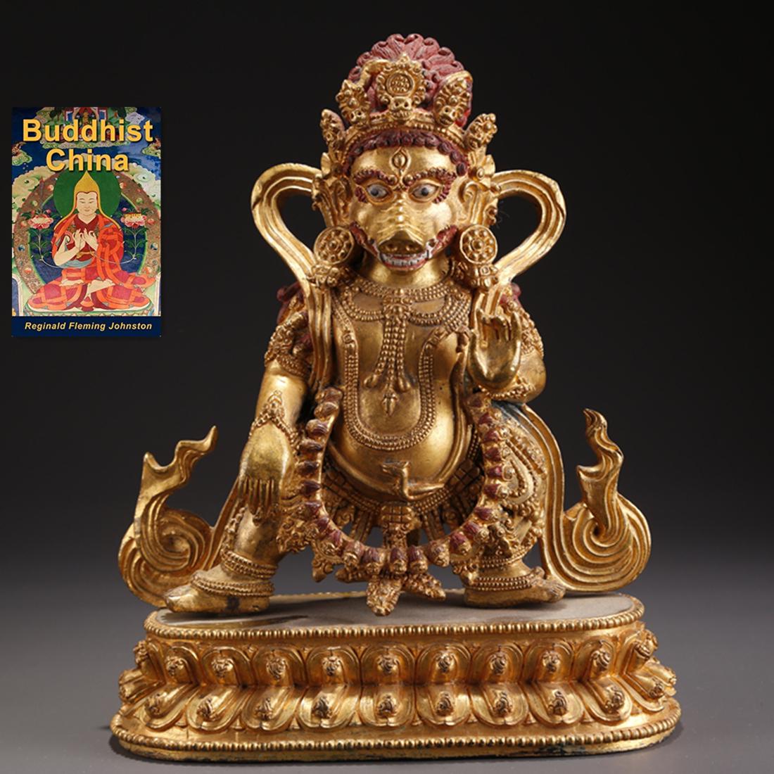 A TIBETAN GILT BRONZE PIG-FACE DAKINI STATUE. (1 of 10)