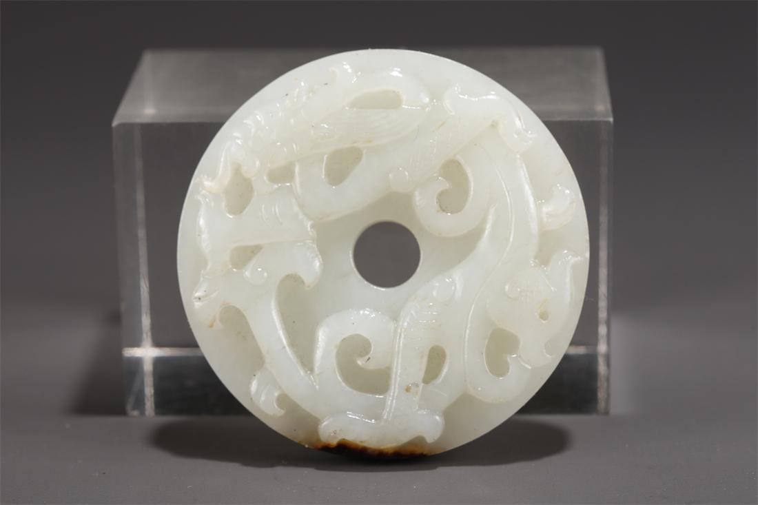 A HETIAN JADE PLATE "BI" WITH DRAGON DESIGN. (1 of 7)