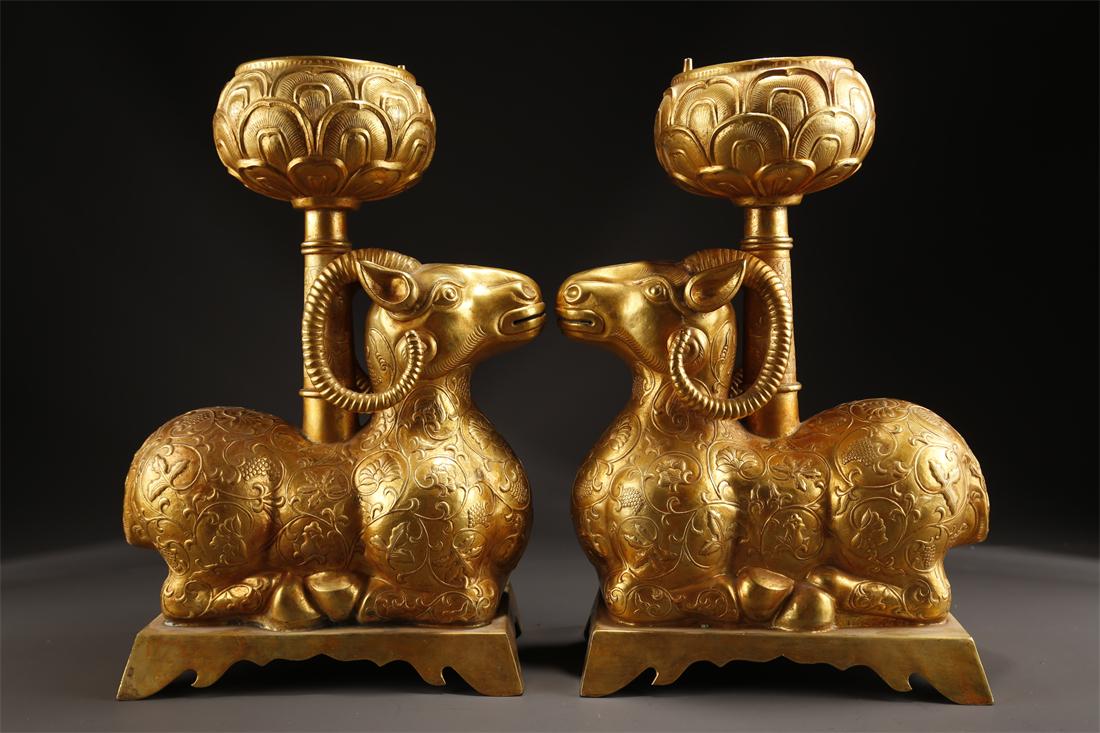 A PAIR OF GILT BRONZE GOAT-SHAPED CANDLESTICKS. (1 of 9)