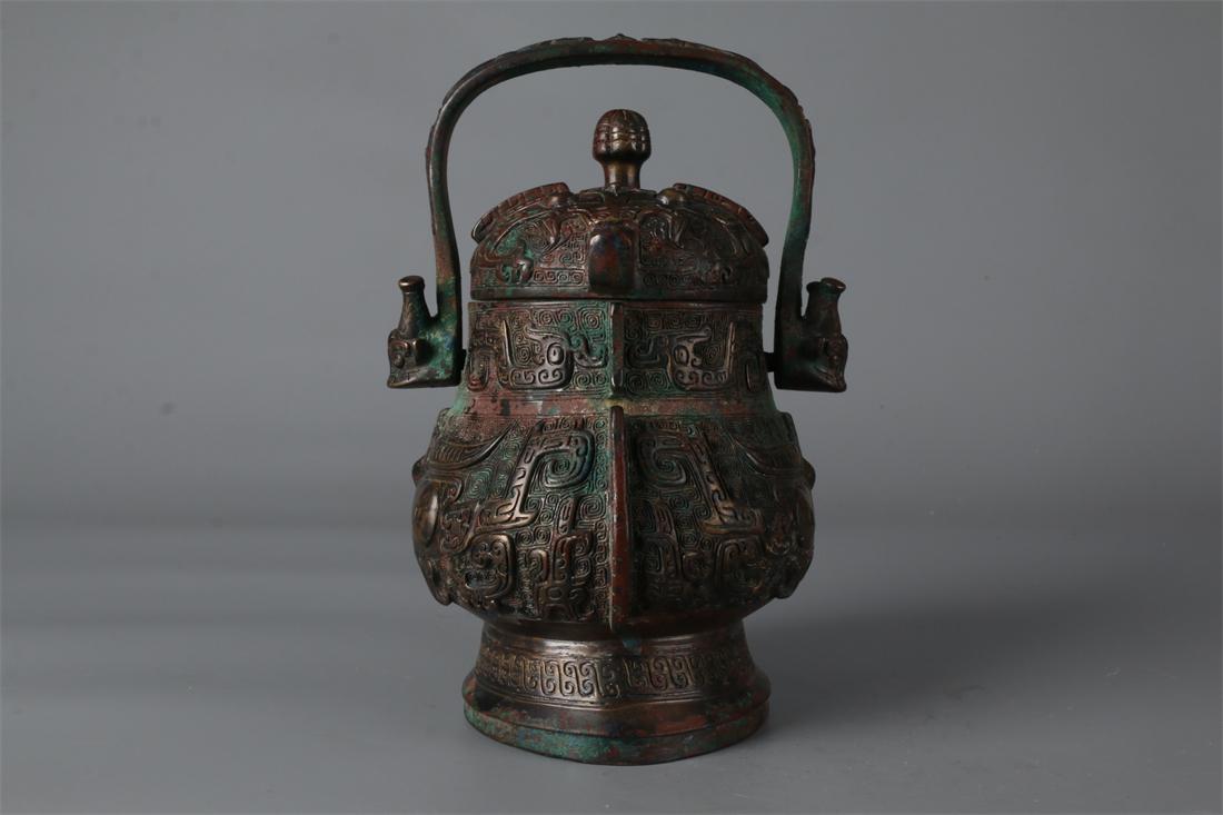 A BRONZE POT "YOU" WITH HANDLE. (1 of 9)