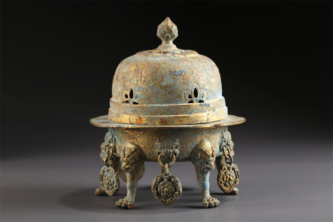 A GILT BRONZE INCENSE BURNER. (1 of 9)