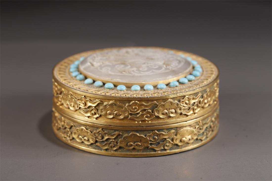 A GILT BRONZE BOX WITH HETIAN JADE INLAY. (1 of 6)
