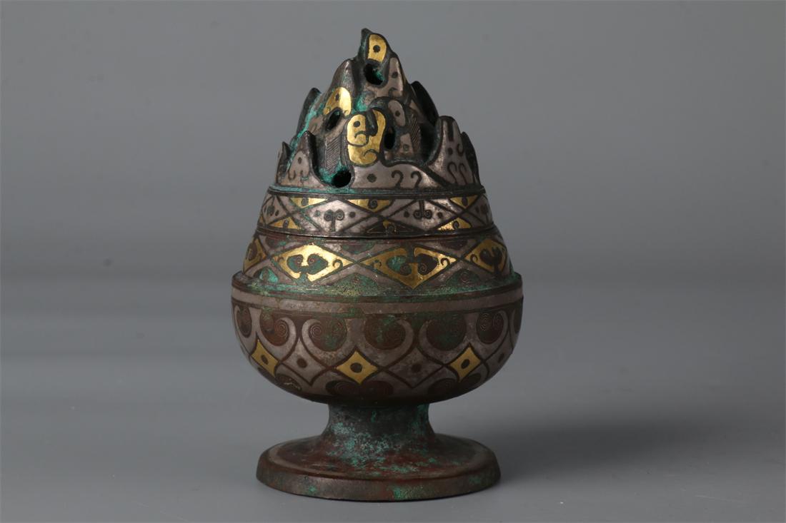 A GILT BRONZE INCENSE BURNER. (1 of 9)