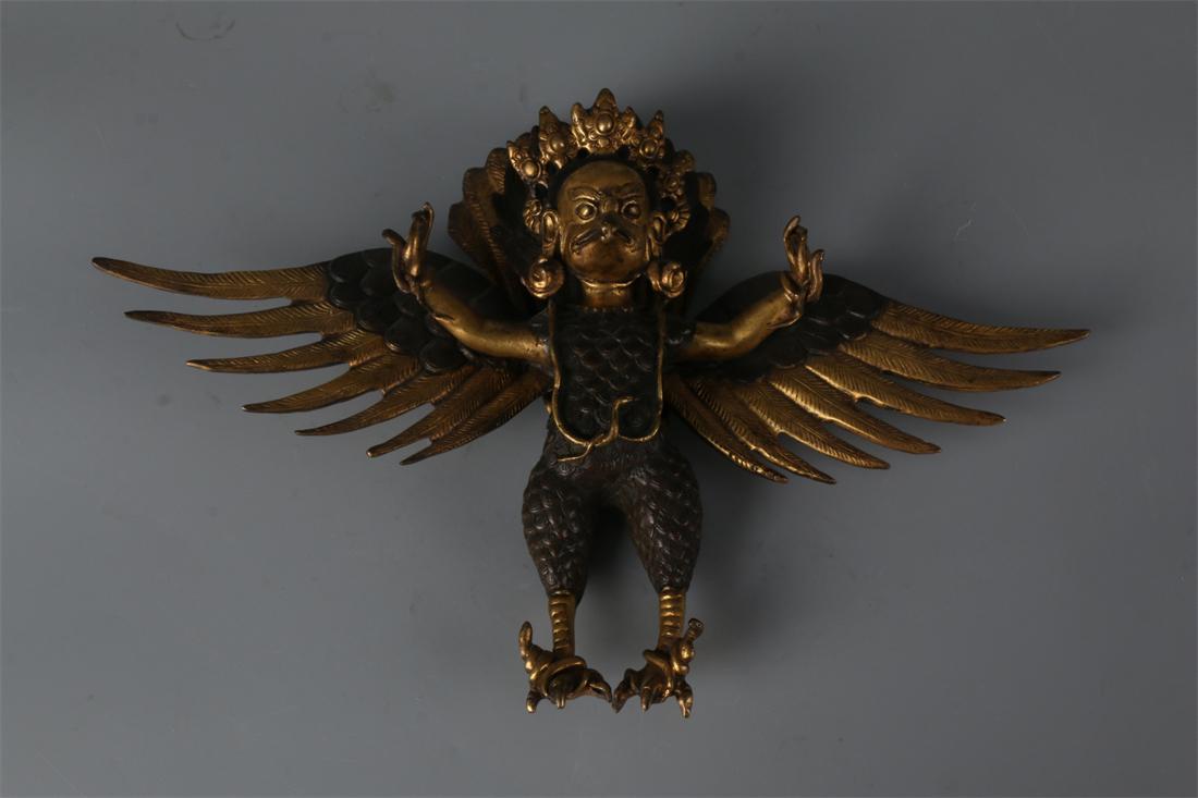 A GILT BRONZE BIRDMAN "LEI ZHENZI" PENDANT. (1 of 9)