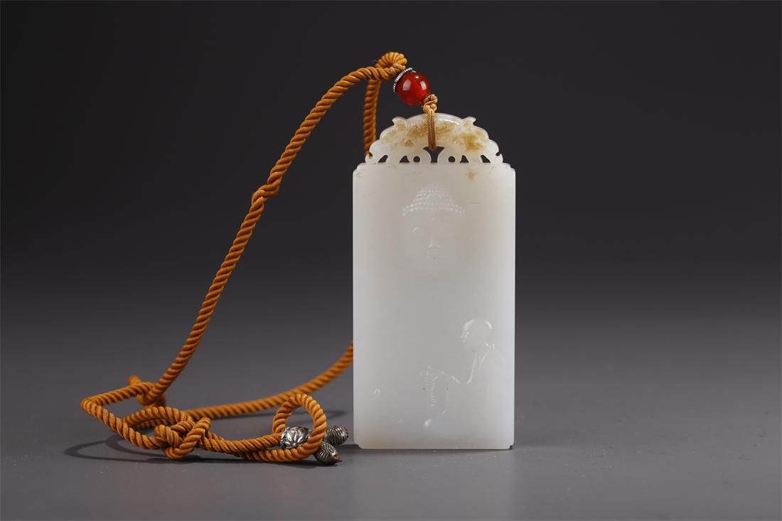 A HETIAN WHITE JADE BUDDHA PENDANT. (1 of 7)
