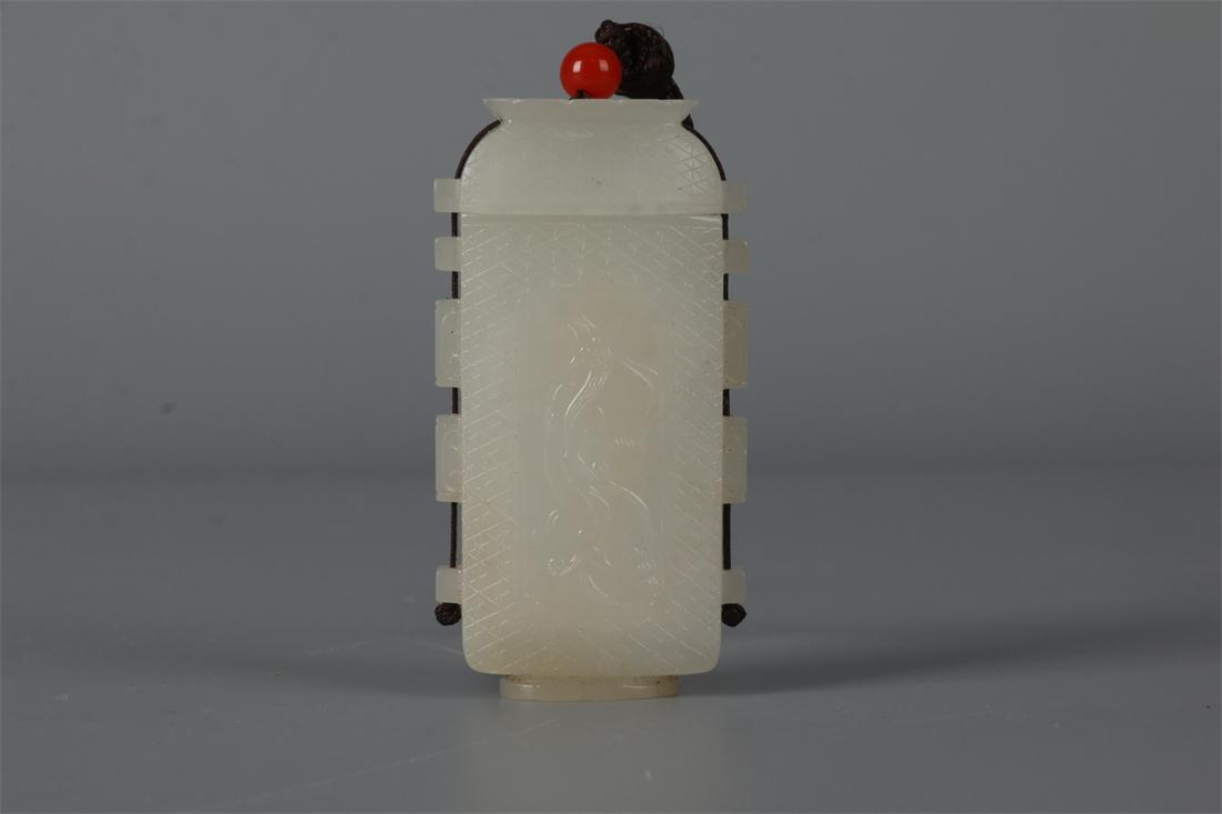 A HETIAN JADE BOTTLE-SHAPED HANDHELD CARVING. (1 of 9)