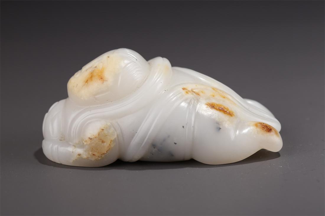 A HETIAN JADE BOY CARVING PENDANT. (1 of 9)