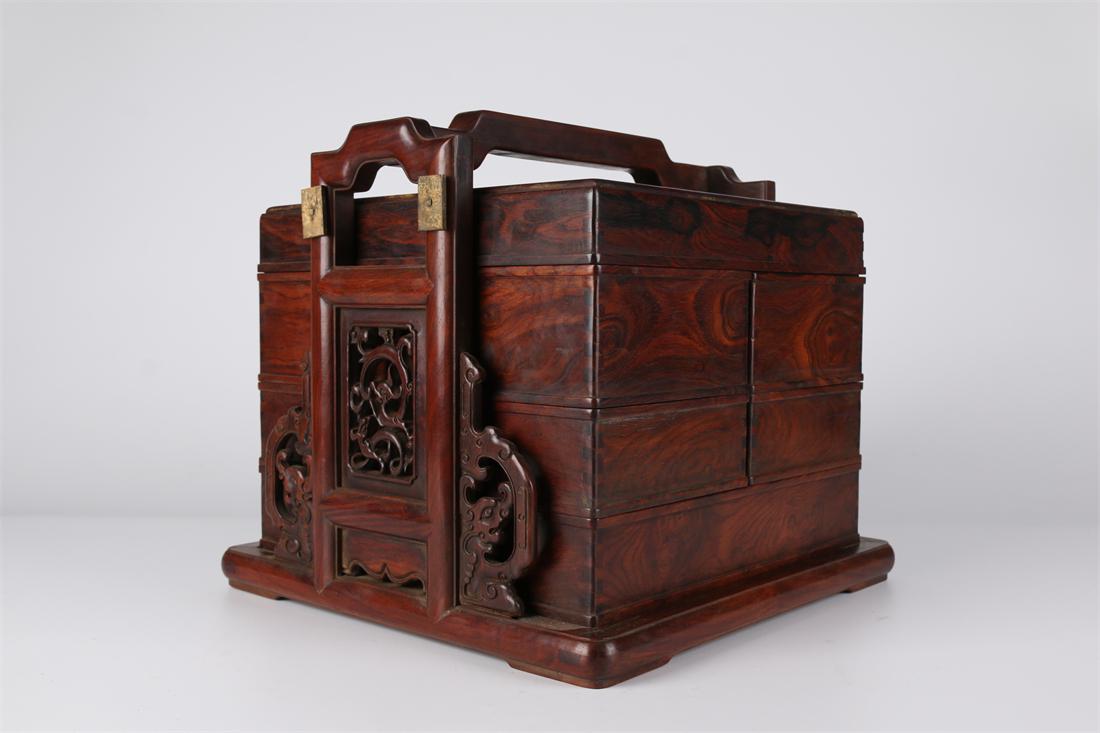 A HUANGHUALI WOOD PORTABLE HAMPER. (1 of 7)