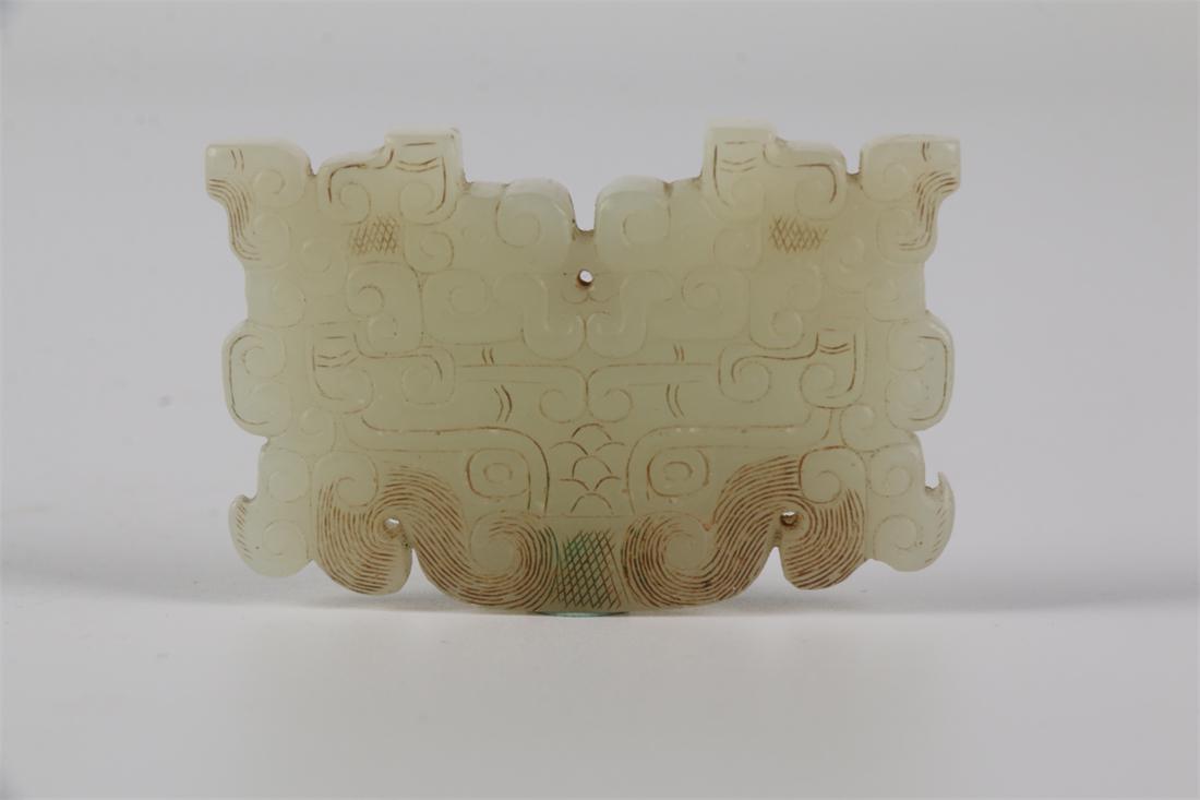 A HETIAN JADE PENDANT. (1 of 9)
