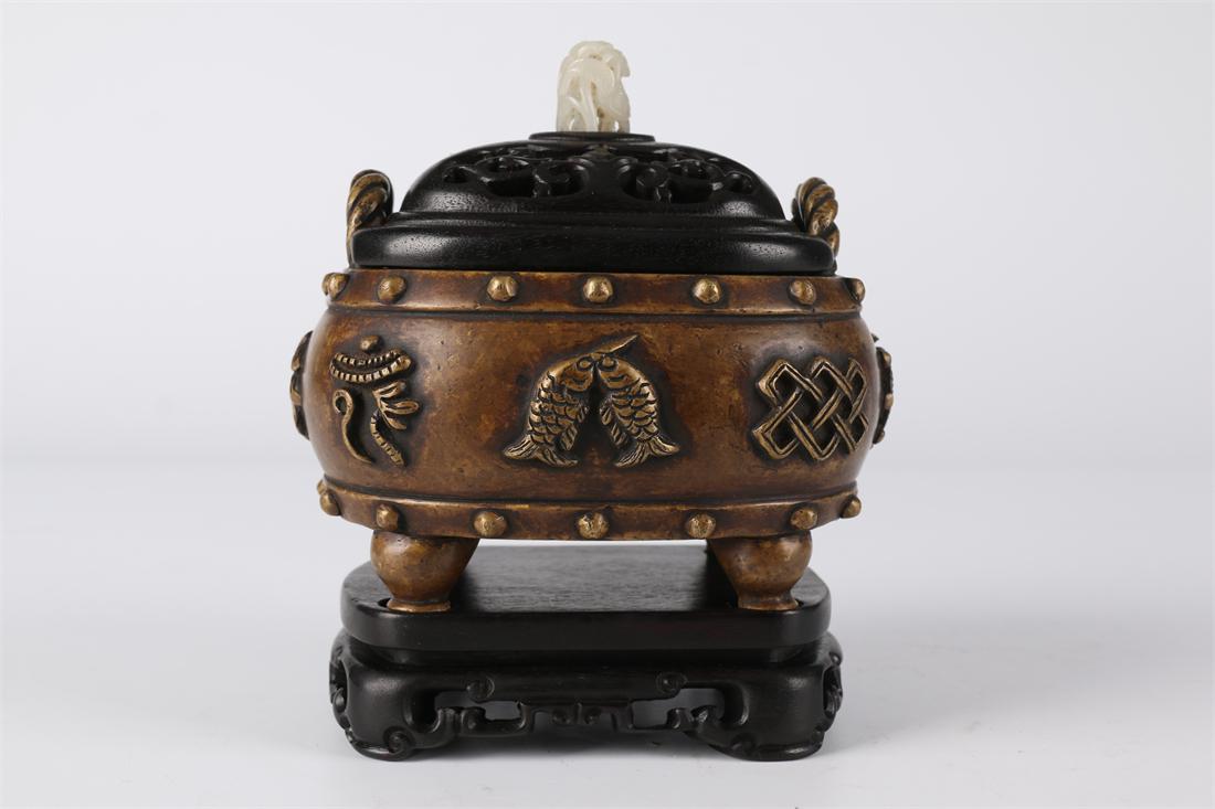A COPPER CENSER WITH LOCK-SHAPED EARS. (1 of 8)