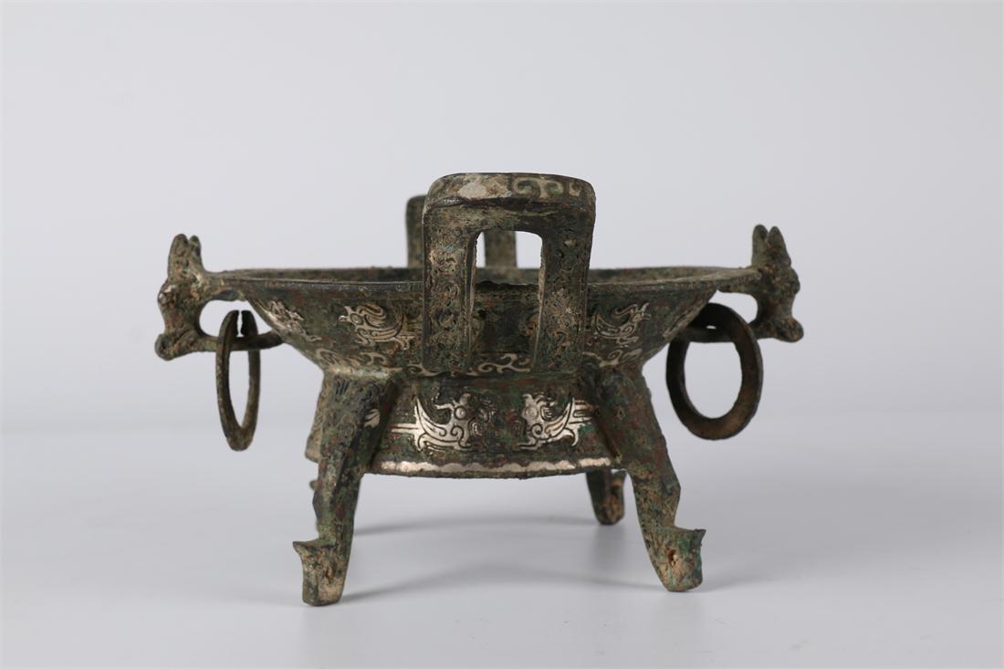 A BRONZE CORNUCOPIA. (1 of 9)