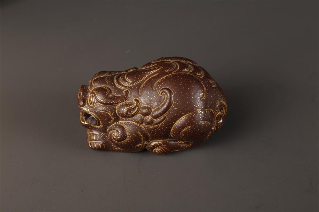 A BIONIC PORCELAIN AUSPICIOUS BEAST SCULPTURE. (1 of 6)