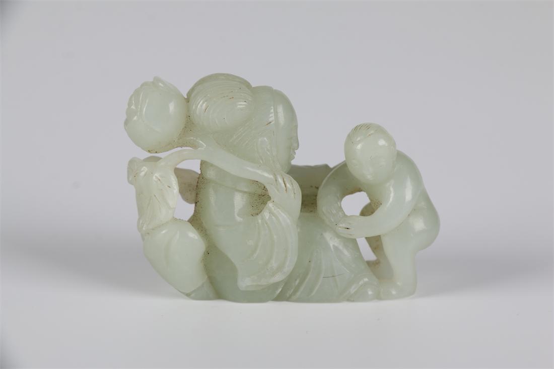 A HETIAN JADE HAPPY FIGURE CARVING ORNAMENT. (1 of 7)